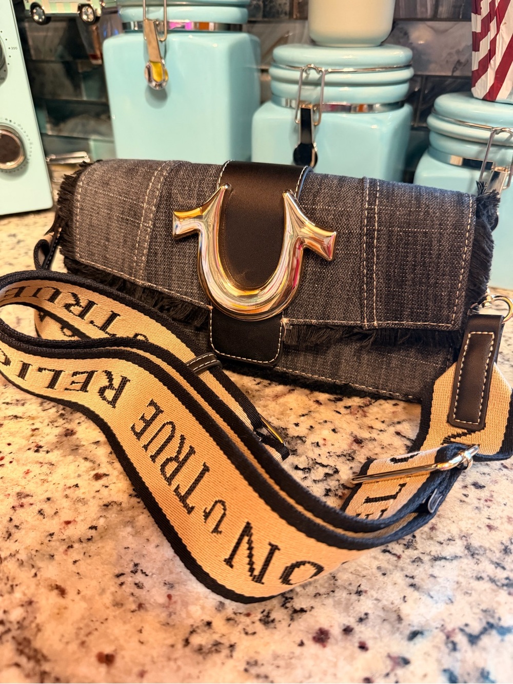 True Religion Black Denim Crossbody with Beige Strap and Silver Logo